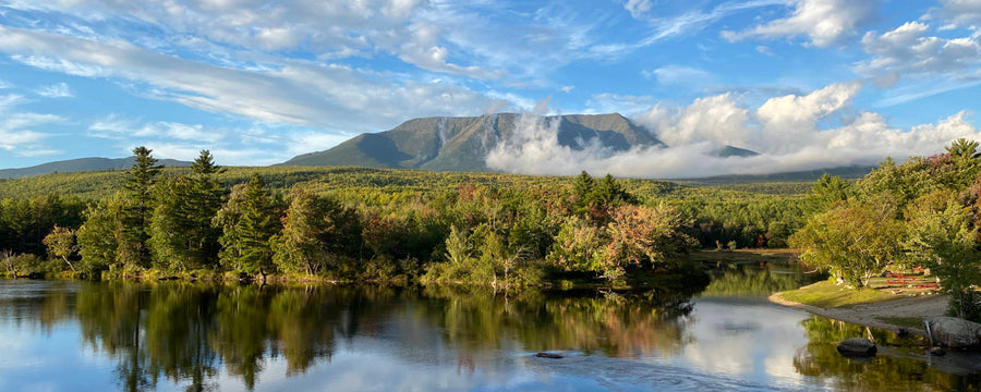 Landscape picture of Mount Katahdin in Maine with fall foilage and the West Pensobscot River in foreground